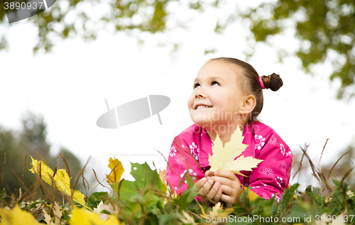 Image of Portrait of a little girl in autumn park