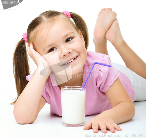 Image of Cute little girl with a glass of milk