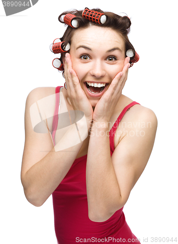 Image of Woman is holding her face in astonishment