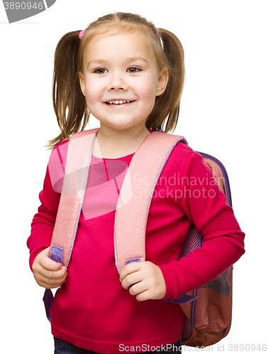 Image of Portrait of a cute little schoolgirl with backpack