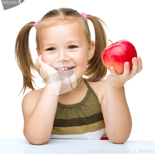 Image of Little girl with red apple