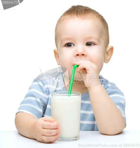 Image of Cute little boy with a glass of milk