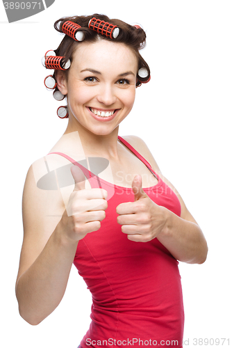 Image of Woman is showing thumb up gesture