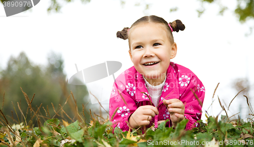 Image of Portrait of a little girl in autumn park