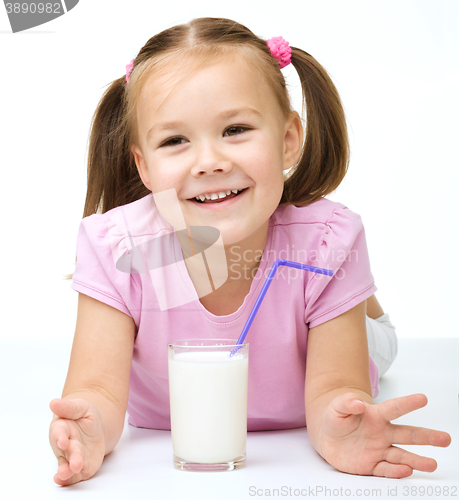 Image of Cute little girl with a glass of milk