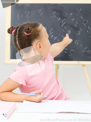 Image of Little girl is studying