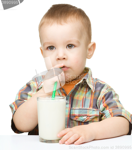 Image of Cute little boy with a glass of milk