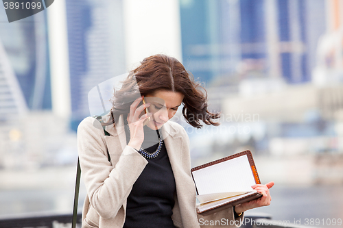Image of business woman talking on the mobile
