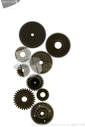 Image of several gear wheels on white