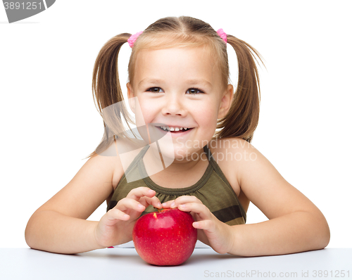 Image of Little girl with red apple