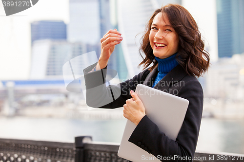 Image of laughing woman with a laptop