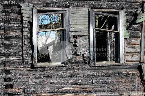 Image of  empty window burnt house