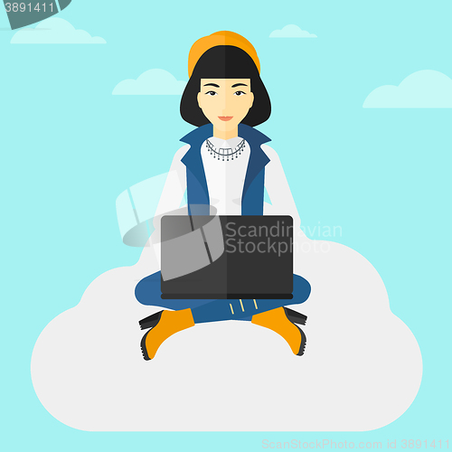 Image of Woman working on laptop.