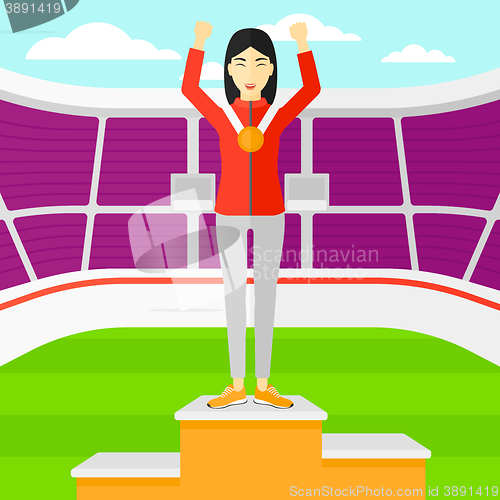 Image of Athlete with medal and hands raised.