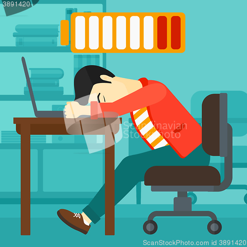 Image of Employee sleeping at workplace.