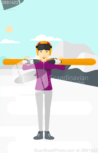 Image of Woman holding skis.