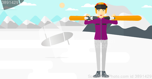 Image of Woman holding skis.