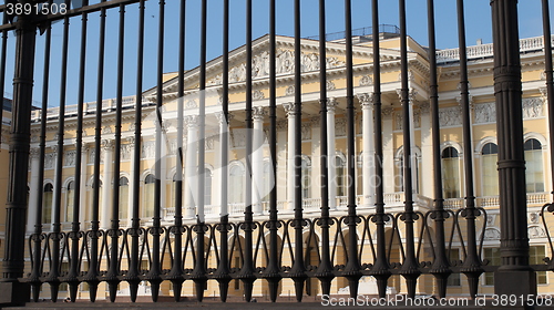Image of  high iron fence in front of palace