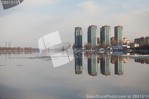 Image of skyscrapers on the river bank