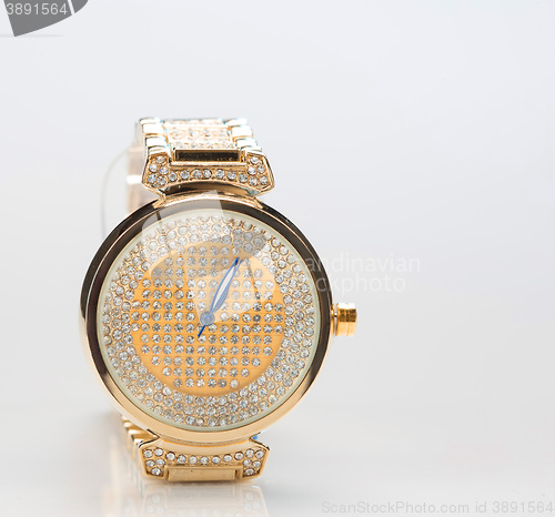 Image of gold watch with diamonds