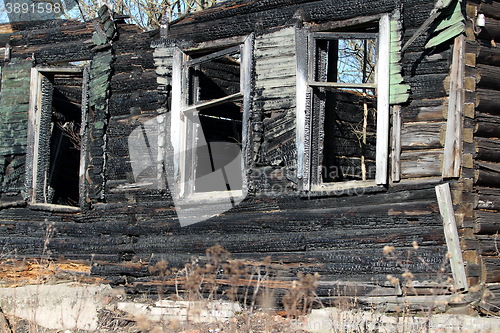 Image of  empty window burnt house
