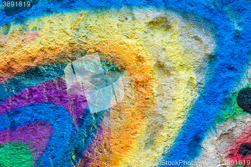 Image of flagstone painted with bright colors.