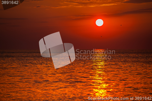 Image of red sunset over water