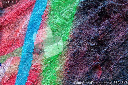 Image of flagstone painted with bright colors.