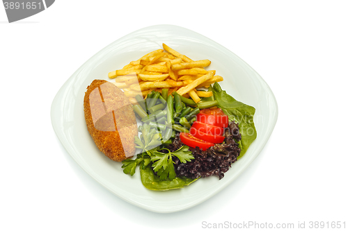 Image of chicken cutlet with vegetables and garnish