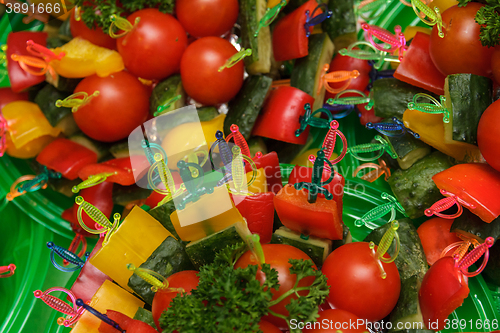 Image of canapes of tomato, cucumber and sweet pepper