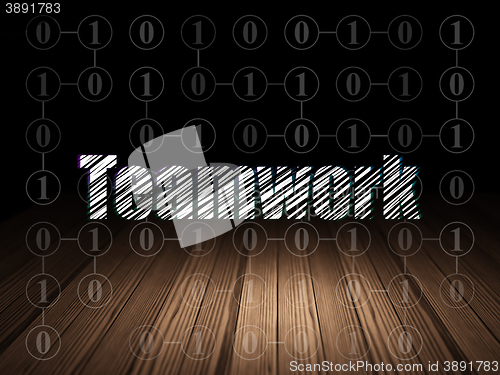 Image of Business concept: Teamwork in grunge dark room