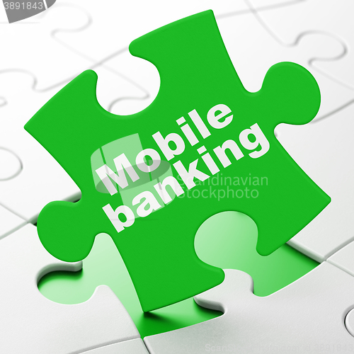 Image of Money concept: Mobile Banking on puzzle background