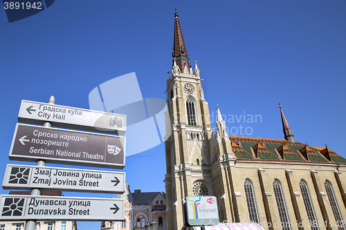 Image of NOVI SAD, SERBIA - APRIL 03: Catholic Cathedral and Tourist sign