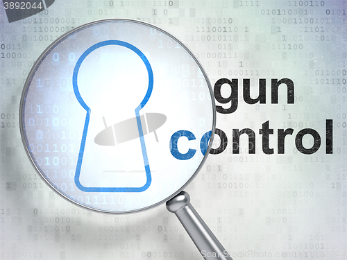 Image of Safety concept: Keyhole and Gun Control with optical glass