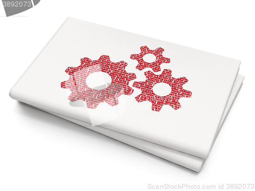 Image of Advertising concept: Gears on Blank Newspaper background