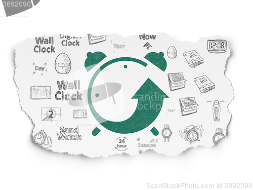 Image of Time concept: Alarm Clock on Torn Paper background