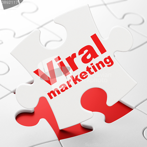 Image of Marketing concept: Viral Marketing on puzzle background