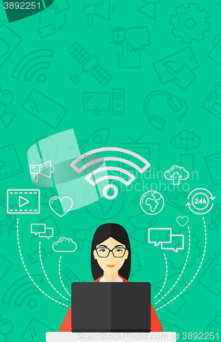 Image of Woman working on laptop.