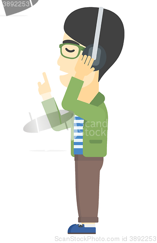Image of Man listening music in headphones