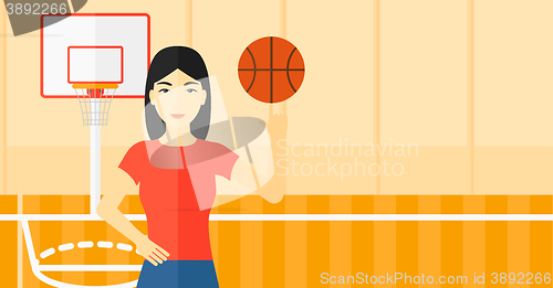 Image of Basketball player spinning ball.