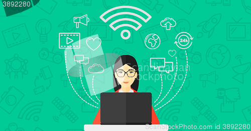 Image of Woman working on laptop.