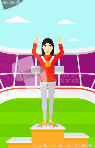 Image of Athlete with medal and hands raised.