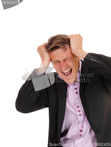 Image of Screaming man scratching his head.