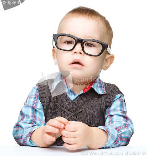 Image of Portrait of a cute little boy wearing glasses