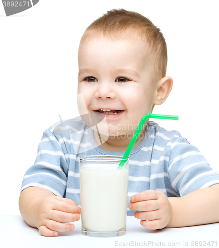Image of Cute little boy with a glass of milk