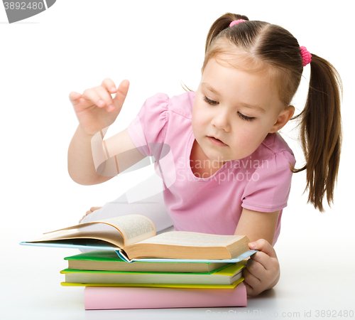 Image of Little girl is reading a book