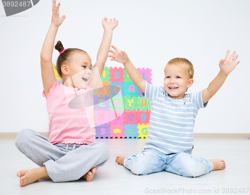 Image of Children are sitting on floor