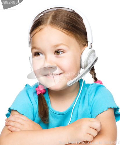 Image of Young girl is working as an operator at helpline