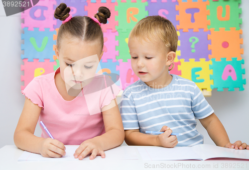 Image of Children are writing on their books