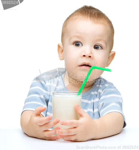 Image of Cute little boy with a glass of milk